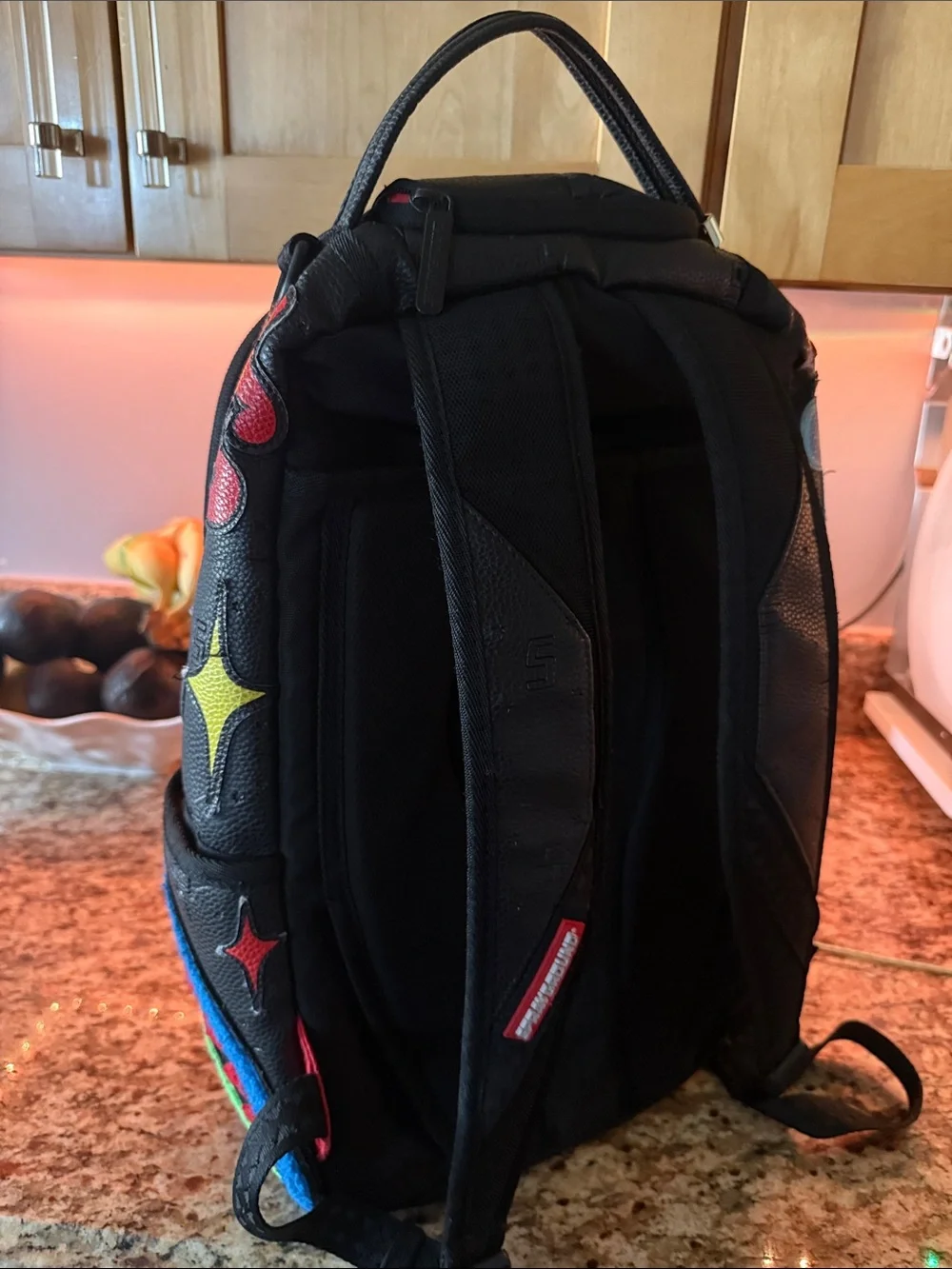 Sprayground Black Backpack with Neon Green Bear Patch and Multicolor Accents